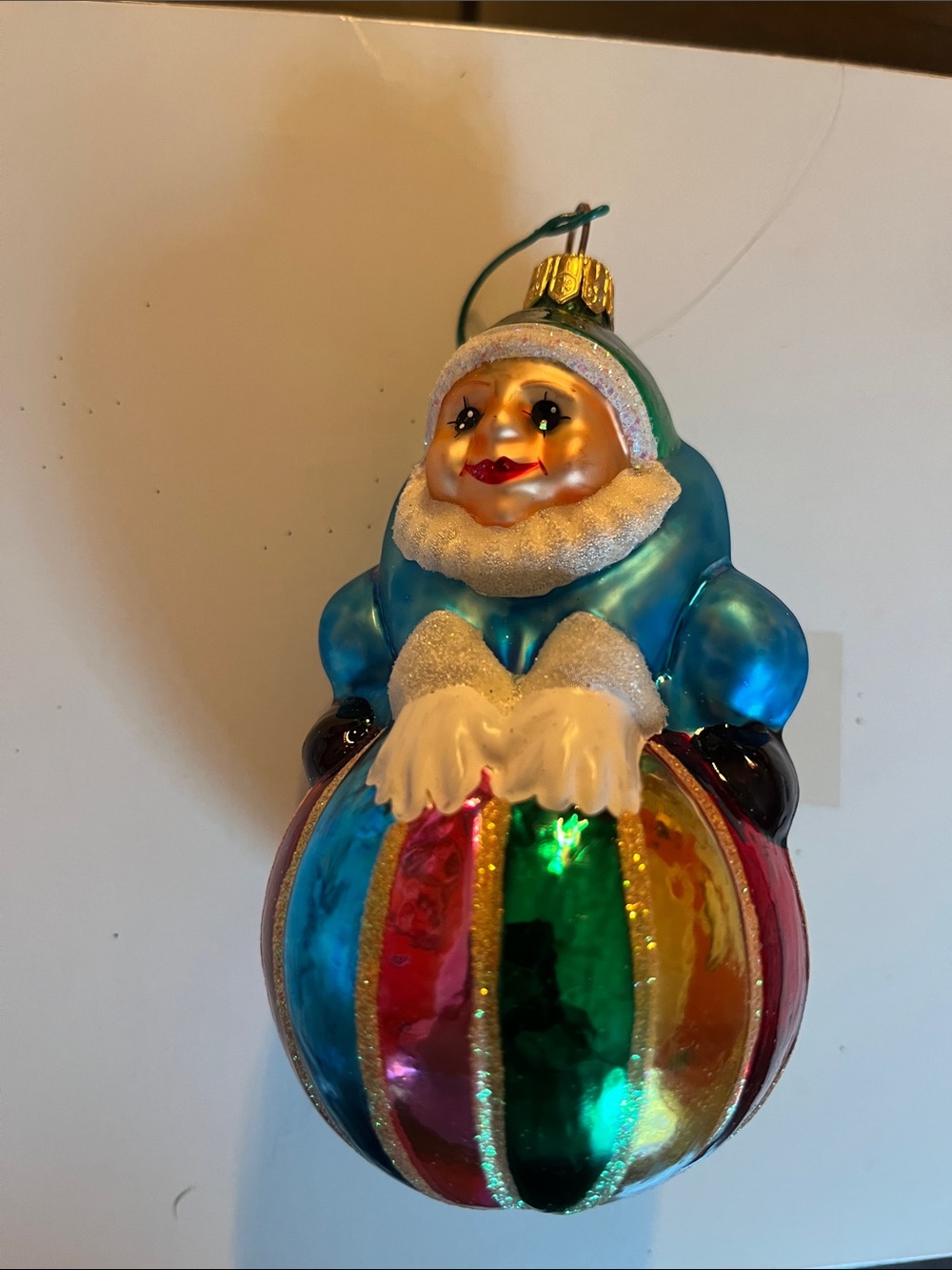 Vintage Blue-Coated Figure Ornament with Multicolor Striped Ball